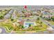 Aerial view of a neighborhood with a community pool and green spaces at 12873 E 108Th Ave, Commerce City, CO 80022
