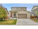 Charming home features a well-kept lawn, covered porch, and a two-car garage, offering curb appeal and practicality at 12873 E 108Th Ave, Commerce City, CO 80022