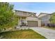 Desirable home boasts a well-manicured lawn, cozy covered porch and a two-car garage for convenience and curb appeal at 12873 E 108Th Ave, Commerce City, CO 80022
