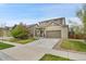 Beautiful two-story home featuring a well-manicured front yard and attached garage in a desirable neighborhood at 12873 E 108Th Ave, Commerce City, CO 80022