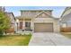 Charming home featuring a covered porch, well-manicured lawn, and a two-car garage for convenience and curb appeal at 12873 E 108Th Ave, Commerce City, CO 80022