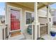 A charming covered front porch offers a cozy seating area with decorative details and inviting curb appeal at 12873 E 108Th Ave, Commerce City, CO 80022