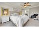 Comfortable main bedroom with cozy décor, including a plush bed, side tables, and lots of natural light at 12873 E 108Th Ave, Commerce City, CO 80022