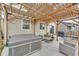 Back patio featuring a hot tub, comfortable seating, pergola, and gas grill perfect for outdoor enjoyment at 12873 E 108Th Ave, Commerce City, CO 80022