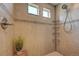 Modern tiled shower with convenient shelving and a stylish shower-head fixture at 12873 E 108Th Ave, Commerce City, CO 80022