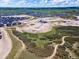 Aerial view showcasing the community layout and surrounding natural landscape at 1672 Fox Trotter Pt, Castle Rock, CO 80104