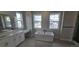Luxurious primary bathroom with freestanding tub, dual vanity with quartz counters, and oversized windows for ample natural light at 1672 Fox Trotter Pt, Castle Rock, CO 80104
