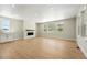 Spacious living room with hardwood floors, fireplace, recessed lights, and bright windows at 1672 Fox Trotter Pt, Castle Rock, CO 80104