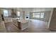 Beautiful open concept with combined kitchen, dining, and living spaces featuring an island and fire place at 1672 Fox Trotter Pt, Castle Rock, CO 80104