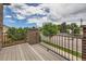 Balcony view overlooking a tree-lined street, with greenery and scenic views at 606 E Dry Creek Pl, Littleton, CO 80122