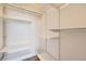 Organized closet with white shelving and ample storage space at 606 E Dry Creek Pl, Littleton, CO 80122