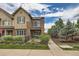 A beautiful exterior elevation of a two story home with manicured lawn and landscaping at 606 E Dry Creek Pl, Littleton, CO 80122