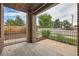 Charming front porch with brick pillars and iron railing, offering a welcoming outdoor space at 606 E Dry Creek Pl, Littleton, CO 80122