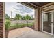Cozy front porch with brick accents and a view of the landscaped front yard at 606 E Dry Creek Pl, Littleton, CO 80122