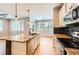 Beautiful kitchen with granite countertops, stainless steel appliances, and open floor plan at 606 E Dry Creek Pl, Littleton, CO 80122