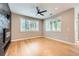 Bright living space featuring hardwood floors, a stone fireplace and sun-drenched windows at 606 E Dry Creek Pl, Littleton, CO 80122