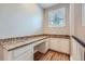 Office space featuring granite countertops, natural light and custom cabinets at 606 E Dry Creek Pl, Littleton, CO 80122