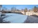 Large backyard patio, partially covered in snow at 1965 E 127Th Cir, Thornton, CO 80241