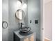 Stylish bathroom featuring a unique black marble vessel sink and modern fixtures at 1965 E 127Th Cir, Thornton, CO 80241