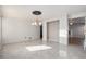 Bright dining room with tile floors and chandelier at 1965 E 127Th Cir, Thornton, CO 80241