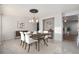 Dining area features tiled flooring, a modern chandelier, and stylish furnishings; perfect for entertaining at 1965 E 127Th Cir, Thornton, CO 80241