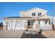 Two-story house with solar panels, attached garage, and landscaped front yard at 1965 E 127Th Cir, Thornton, CO 80241