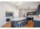 Modern kitchen with island, stainless steel appliances, and dark blue cabinetry at 1965 E 127Th Cir, Thornton, CO 80241