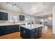 Modern kitchen with island, stainless steel appliances, and dark blue cabinetry at 1965 E 127Th Cir, Thornton, CO 80241