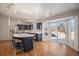 Modern kitchen with island, stainless steel appliances, and dark blue cabinetry at 1965 E 127Th Cir, Thornton, CO 80241