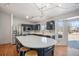 Modern kitchen with island, stainless steel appliances, and dark blue cabinetry at 1965 E 127Th Cir, Thornton, CO 80241