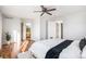 Tranquil main bedroom with hardwood floors, ceiling fan, and ensuite bathroom at 1965 E 127Th Cir, Thornton, CO 80241