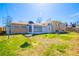 Spacious backyard with patio and sunroom, perfect for relaxation and entertaining at 1085 Kingston St, Aurora, CO 80010