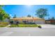Charming single-story home features a well-kept lawn, mature trees, and attached two-car garage at 1085 Kingston St, Aurora, CO 80010