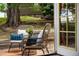 Comfortable back patio area with seating and nature views at 1140 Magic Lamp Way # 4, Monument, CO 80132