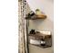 Bathroom shelves with modern decor, plants and towels at 1140 Magic Lamp Way # 4, Monument, CO 80132
