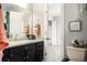 Bathroom with sink, mirror and access to a bedroom with carpet at 1140 Magic Lamp Way # 4, Monument, CO 80132