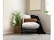 Cozy bedroom corner with stylish chair and green plants at 1140 Magic Lamp Way # 4, Monument, CO 80132