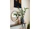 Console table with a stylish decor including a mirror and plants at 1140 Magic Lamp Way # 4, Monument, CO 80132