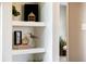 Chic shelving décor with plants and modern accents at 1140 Magic Lamp Way # 4, Monument, CO 80132