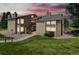 Inviting exterior view of a two-story condo featuring well-kept landscaping and a private entrance at 1140 Magic Lamp Way # 4, Monument, CO 80132