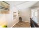 Hallway with decorative wall hangings and wood floors and access to a room at 1140 Magic Lamp Way # 4, Monument, CO 80132