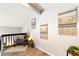 Hallway with decorative wall hangings, wood floors and chair with pillow at 1140 Magic Lamp Way # 4, Monument, CO 80132