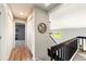 Hallway with wood floors, closet, decor and access to rooms and staircase at 1140 Magic Lamp Way # 4, Monument, CO 80132
