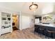 Kitchen features an island with stools, and easy access to the hallway and bathroom at 1140 Magic Lamp Way # 4, Monument, CO 80132