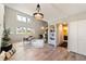 Open-concept living room features large windows and modern design at 1140 Magic Lamp Way # 4, Monument, CO 80132