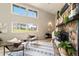 Bright living room featuring vaulted ceilings, a stone fireplace, and comfortable seating, creating a welcoming atmosphere at 1140 Magic Lamp Way # 4, Monument, CO 80132