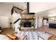 Inviting living space with a stone fireplace, open floor plan, and modern decor, perfect for entertaining at 1140 Magic Lamp Way # 4, Monument, CO 80132