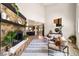 Spacious living room featuring a stone fireplace, vaulted ceilings, and contemporary furnishings at 1140 Magic Lamp Way # 4, Monument, CO 80132