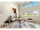 Bright living room with large windows, neutral decor, and modern furnishings, creating an inviting space at 1140 Magic Lamp Way # 4, Monument, CO 80132