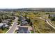 An aerial view of a community with homes, green spaces, walking paths and distant mountain views at 882 Eldorado Dr, Superior, CO 80027